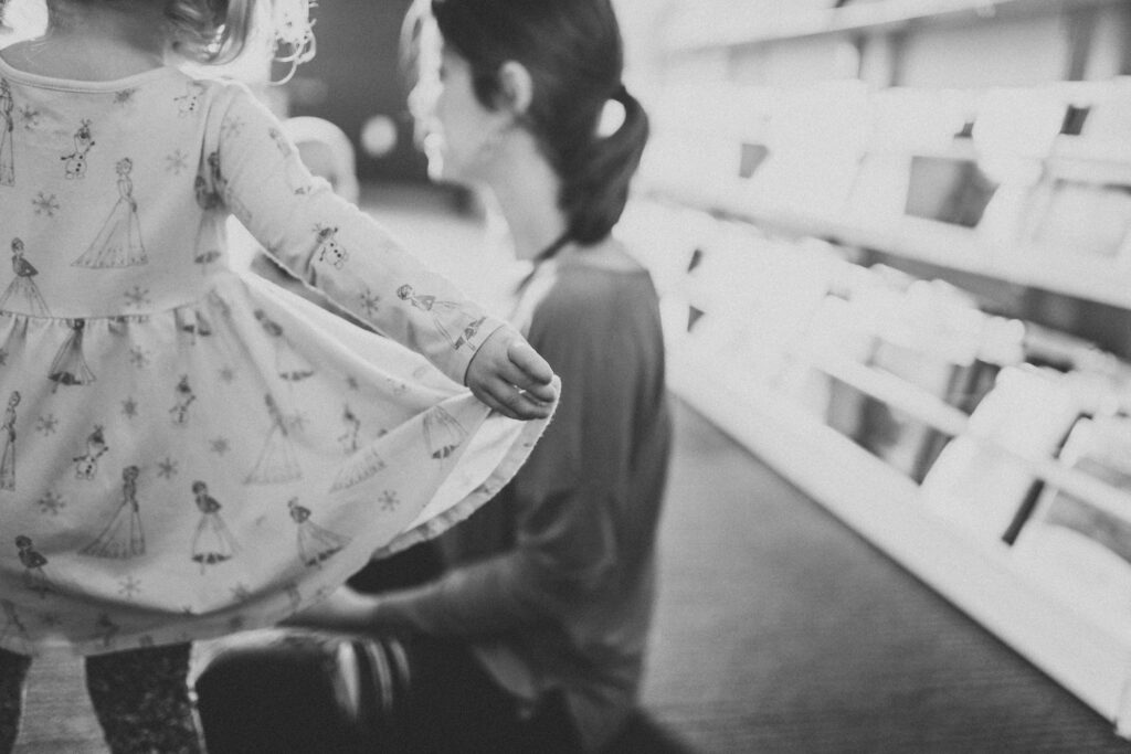 Mother and  kids hang out in the library as an example of family photo location ideas. 